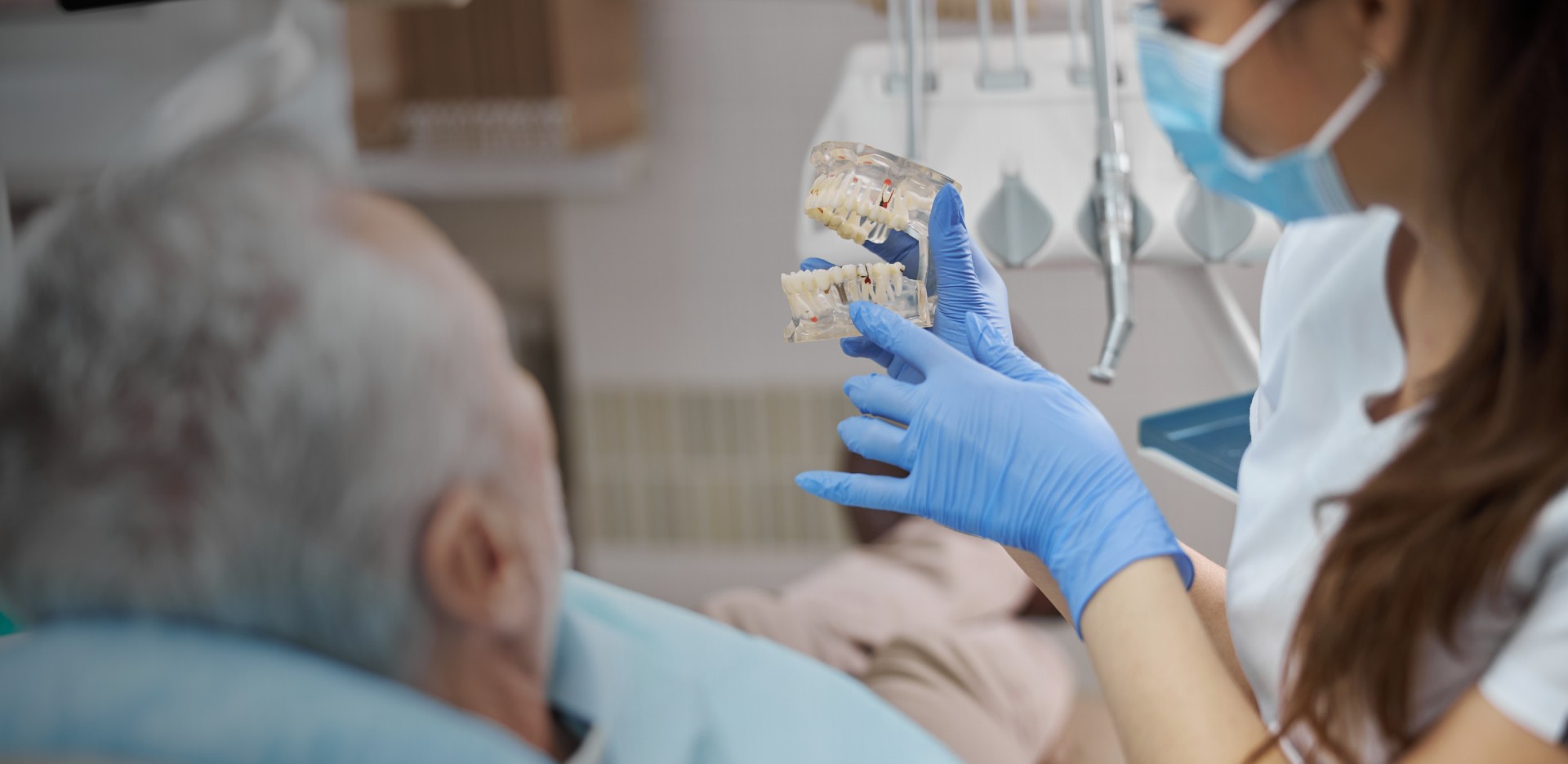 qualified-female-dental-technician-holding-dental-2021-09-03-14-34-32-utc_2